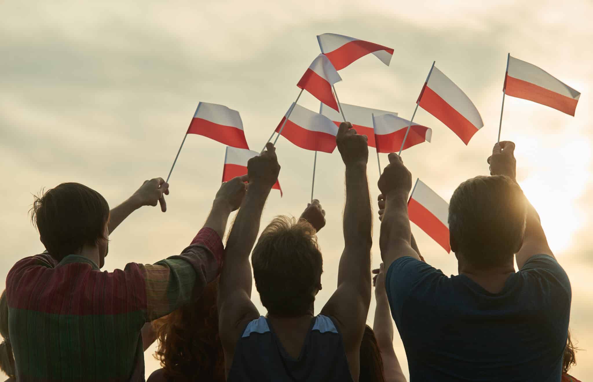 Waving,Poland,Flags.,Back,View,Silhouette,Of,Polish,Family.